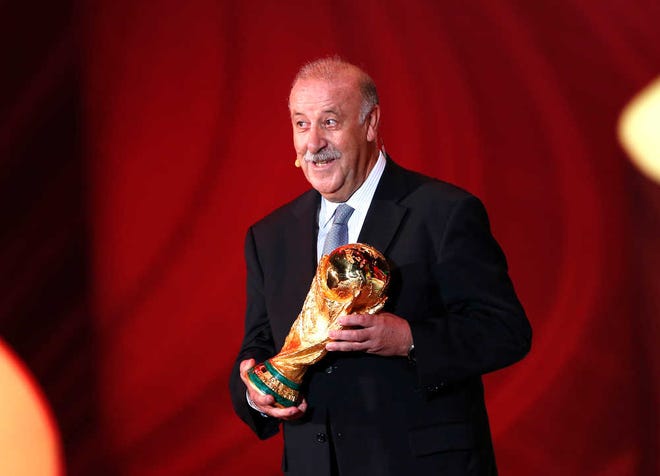 Spain head coach Vicente Del Bosque holds the World Cup trophy during the draw ceremony for the 2014 soccer World Cup in Costa do Sauipe near Salvador, Brazil, on Friday.