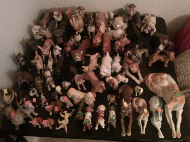 Among this collection of more than 400 dog figurines are Goebel, Royal Dux, Royal Doulton and Beswick.