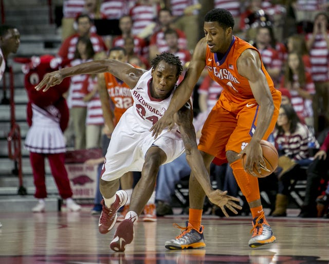 The Associated Press  Arkansas guard Michael Qualls, left, attempts to steal the ball from Clemson guard Demarcus Harrison during the first half Saturday, Dec. 7, 2013, at Bud Walton Arena in Fayetteville. 
 The Associated Press Arkansas forward Bobby Portis attempts to block a shot by Clemson guard Demarcus Harrison during the second half Saturday, Dec. 7, 2013, at Bud Walton Arena in Fayetteville. The Razorbacks won 74-68. 
 The Associated Press  Arkansas guard Fred Gulley III yells at a teammate during the second half against Clemson on Saturday, Dec. 7, 2013, at Bud Walton Arena in Fayetteville. Arkansas won 74-68.