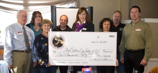 The Chalfont New Britain Business Alliance recently donated $1,000 to Big Brothers Big Sisters of Bucks County. The funds represent proceeds from the alliance's annual Family Fun Day event in October. From left: Robert Showalter, Patti Fitzpatrick, Susan Stroh, Scott Stokes, Big Brothers Big Sisters CEO Ursula Raczak, Susan Gelb, Dale Rimmer and Brian Wallace.