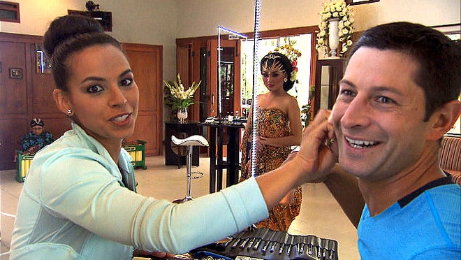 Amy Diaz of Providence, left, and Jason Case of Attleboro must make each other up as a traditional Javanese bride in order to receive the next clue on "The Amazing Race."