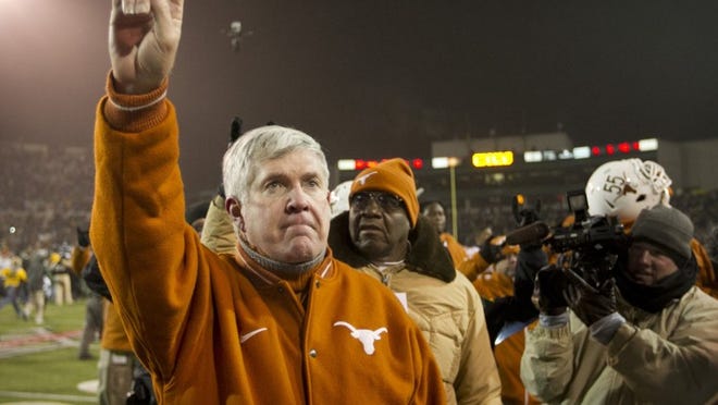 Texas head coach Mack Brown, shown after Saturday’s regular-season finale loss to Baylor, continues to be the center of coaching rumors regarding his future.