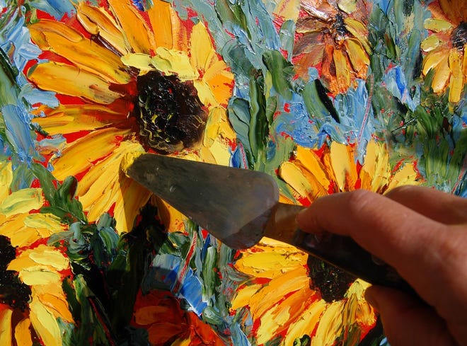 A close-up look at the palette knife being used to create Sunflowers Gone Wild.