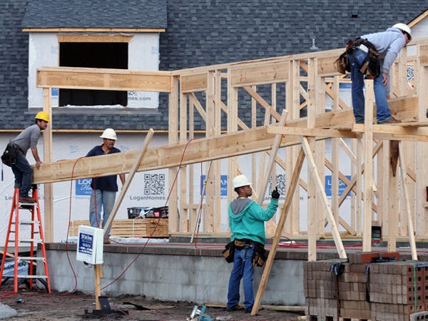 Construction crews work on building new homes in the Brunswick Forest Development in Leland, N.C. on Monday, December 9, 2013.