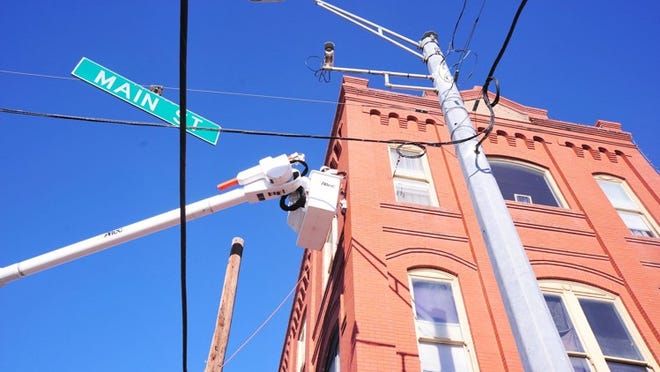City of Smithville workers have strung approximately 4,000 feet of wire for lighting downtown for the holiday season.