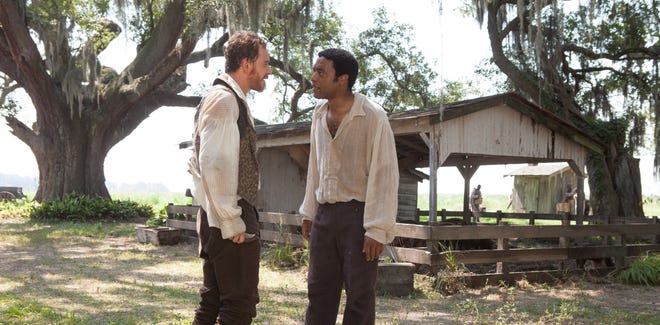 Michael Fassbender, left, and Chiwetel Ejiofor in "12 Years A Slave."