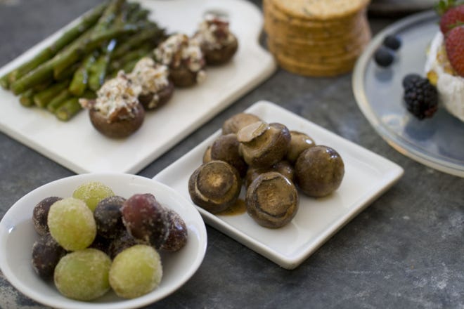 Feed a crowd in high style with 10 base ingredients dressed up to please any tastes. Sugared grapes, roasted asparagus, stuffed mushrooms, marinated mushrooms and warm brie with berries are easy to prepare with just a little prep.
