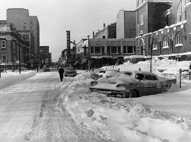 Seven inches of snow clogged sidewalks on March 5, 1964, which forced this pedestrian to walk in the plowed road. The 1964 snowstorm marked the first time in forty-six years that Rockford public schools closed because of the weather when a storm dumped 16.3 inches of snow in a 24-hour period between Jan. 6 and Jan. 7, 1918.
