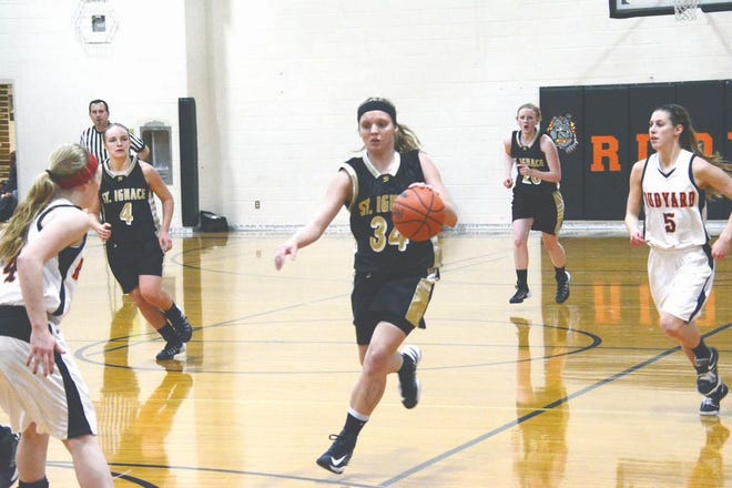Emily Hinsman of St. Ignace drives to the basket during a game against Rudyard.
