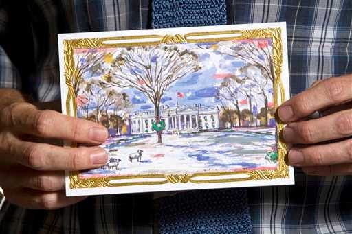 John Hutton, an art professor at Salem College, holds the holiday card he was commissioned to create by the White House Historical Association in Winston-Salem, N.C.