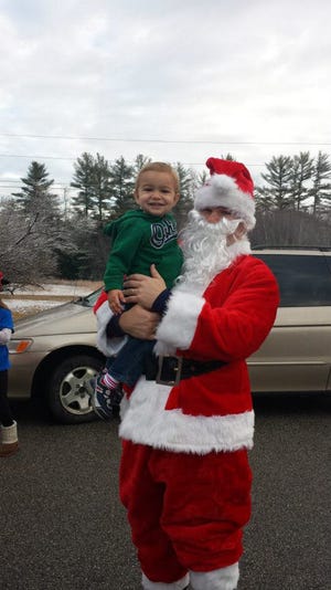 Lebanon youngster Desmond Montgomery meets the Jolly Old Elf himself, Santa Claus, during a trip to Stokewood’s Diner on Route 202 on Saturday morning.