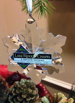 CONTINUED SUPPORT - Lake Ridge Chapel and Memorial Designer's fifth annual Service of Encouragement was held on Dec. 10, offering an evening of quiet reflection, beautiful music and encouraging words to the families they've served this year. The Lake Ridge staff presented each family with a beautiful Christmas ornament in the shape of a snowflake, personalized with the name of their loved one.