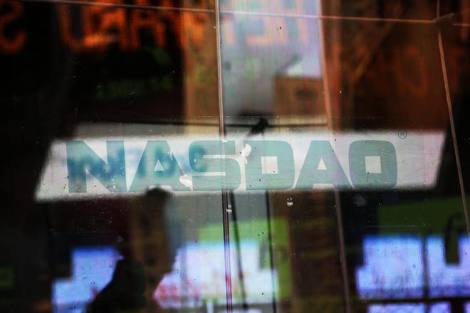 AP photo

Electronic billboards are reflected in the windows of Nasdaq in New York. The Nasdaq Composite is up 35 percent in 2013, but while other major indexes like the Dow Jones industrial average and Standard & Poor s 500 have celebrated all-time highs again and again, the Nasdaq remains 20 percent below its dot-com peak of 5,048.62.