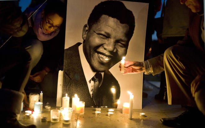 Tributes to the late South African President Nelson Mandela light up Trocadero Square in Paris on Sunday.