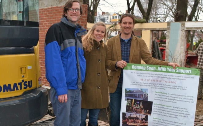 Prescott Park Executive Director Ben Anderson (holding sign) tours the construction site with fellow staffers Hannah Comeau and John Moynihan. The old bathroom and snack bar building is being torn down to make way for a larger facility which will house ADA accessible restrooms and expanded kitchen operations.