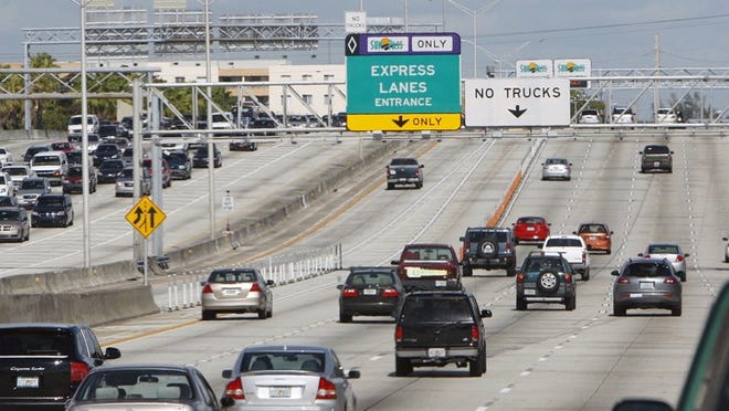 Sunpass-only Express Lanes Entrance sign on the northbound Interstate 95 in Miami-Dade County. (Miami Herald staff photo by John VanBeekum)