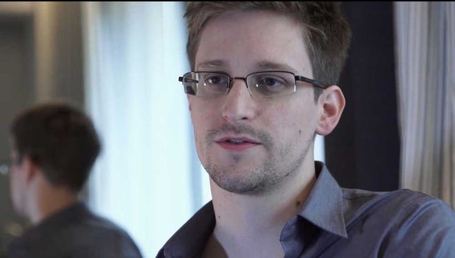 FILE - This June 9, 2013 file photo provided by The Guardian Newspaper in London shows National Security Agency leaker Edward Snowden, in Hong Kong. Snowden wrote in "an open letter to the Brazilian people" published early Tuesday, Dec. 17, 2013 by the respected Folha de S. Paulo newspaper that he would be willing to help Brazil's government investigate U.S. spying on its soil, but that he could do so only if granted political asylum. (AP Photo/The Guardian, Glenn Greenwald and Laura Poitras, File)