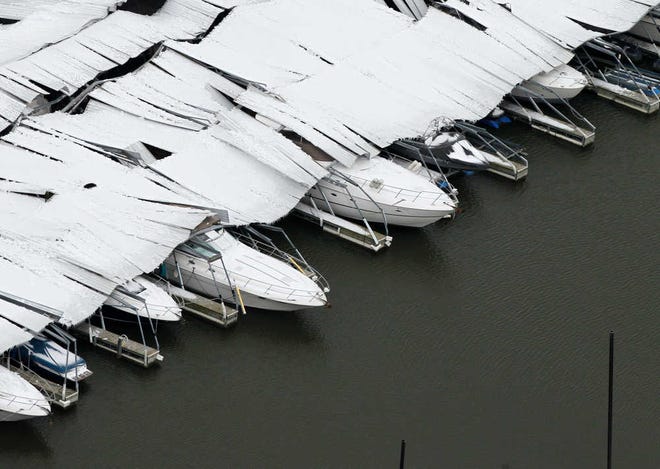 A section of a canopy that collapsed due to ice sits on several boats Dec. 7 at Lake Lewisville. An ice storm in the Dallas-Fort Worth area this month slightly improved the drought in parts of North Texas.