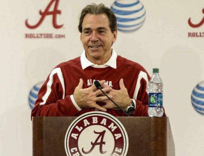 Alabama coach Nick Saban reacts to questions about becoming a grandfather, during a news conference Tuesday, Dec, 17, 2013, at the Mal Moore Athletic Facility in Tuscaloosa, Ala. (AP Photo/AL.com, Vasha Hunt) MAGS OUT