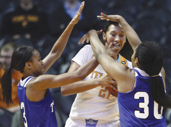 Tennessee’s Mercedes Russell is defended by Tennessee State’s Imani Davis (3) and Chelsea Hudson on Tuesday. (Wade Payne | Associated Press)