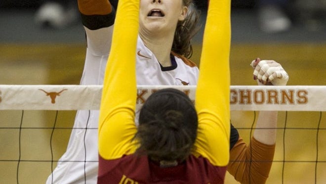 Longhorn middle blocker Molly McCage, hitting a spike against Iowa State’s Victoria Hurtt in a match earlier this season, recorded eight block assists last week in a sweep of Nebraska, a victory that earned Texas a berth in the NCAA Final Four.