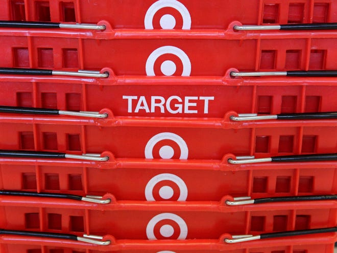 In this May 20, 2009 file photo, shopping baskets are stacked at a Chicago area Target store.