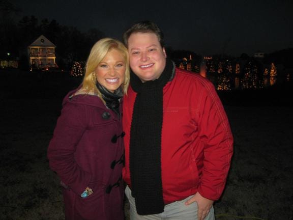 Wade Allen shares a moment with “Fox and Friends” correspondent Anna Kooiman in McAdenville early Thursday.