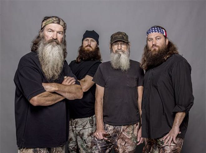 his 2012 photo released by A&E shows, from left, Phil Robertson, Jase Robertson, Si Robertson and Willie Robertson from the A&E series, "Duck Dynasty." A&E says nearly 12 million birds of a feather caught the season premiere of the hit unscripted series on Wednesday, Aug. 14, 2013.