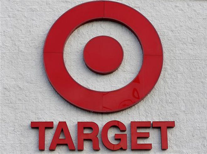 This Thursday, Dec. 19, 2013 photo shows a Target retail chain logo on the exterior of a Target store in Watertown, Mass. Target says that about 40 million credit and debit card accounts may have been affected by a data breach that occurred just as the holiday shopping season shifted into high gear.