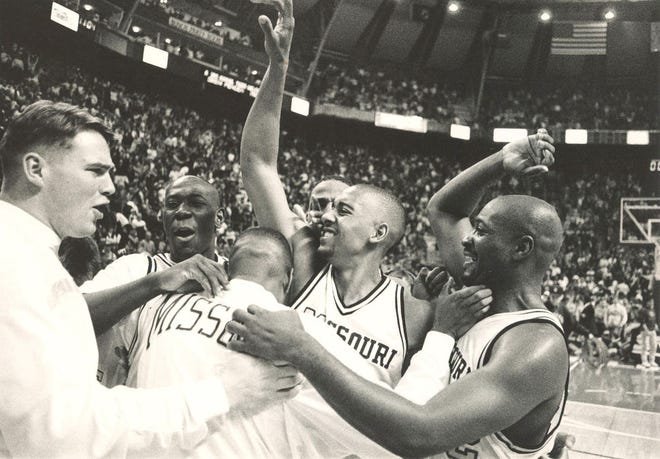 Missouri’s Julian Winfield, second from right, and Lamont Frazier, right, lead the Tigers’ celebration at midcourt after a 108-107 triple-overtime victory over Illinois in the 1993 Braggin’ Rights game in St. Louis. The victory sparked the Tigers to an undefeated Big Eight regular season and a run to the Elite Eight.