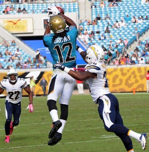 Bob.Mack@jacksonville.com Jaguars receiver Mike Brown makes a catch at the sidelines as Johnny Patrick defends after a 12-yard pass from Chad Henne on Oct. 20 at EverBank Field.