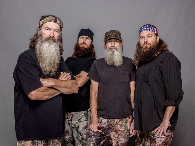 This 2012 photo released by A&E shows, from left, Phil Robertson, Jase Robertson, Si Robertson and Willie Robertson from the A&E series, "Duck Dynasty." The A&E channel says "Duck Dynasty" patriarch Phil Robertson is off the show indefinitely after condemning gays as sinners in a magazine interview. In a statement Wednesday, Dec. 18, 2013, A&E said it was extremely disappointed to read Robertson's comments in GQ magazine. (AP Photo/A&E, Zach Dilgard)