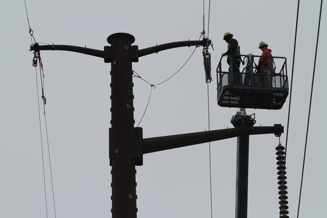 National Grid workers upgraded transmission lines earlier this year.