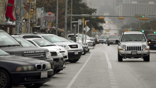 Cars are parked on South Congress Avenue earlier this month. City officials and merchants along South Congress Avenue are discussing ways to address parking issues in the area.DEBORAH CANNON / AMERICAN-STATESMAN