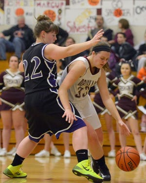 Tina Russell / Observer-Dispatch  From left, West Canada player Carissa Tasovac attempts to block Oriskany player Jordan Sahl as she prepares to pass the ball to a teammate during girls basketball at Oriskany High School Saturday, Dec. 21, 2013.