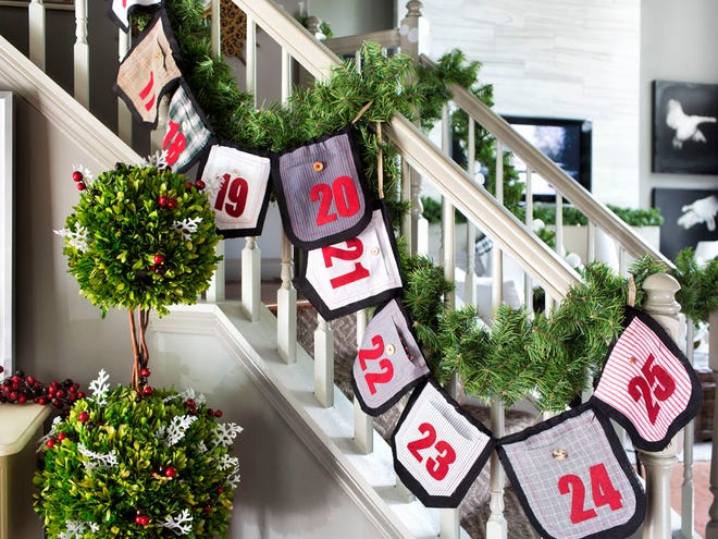 In this photo provided by Brian Patrick Flynn, the designer Flynn for HGTV.com uses swatches of mens' shirt fabrics to create this holiday garland that also serves as an advent calendar. Use it to bring color and holiday style to a staircase, and tuck tiny gifts inside.