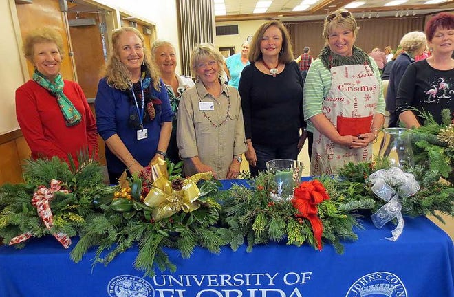 Displaying their creative centerpieces are Deb Kolasinksky, from left, Kathy Luoma, Jeanne Mickler, Sue Steger, Linda Rehberg and Diane Tamplin.
