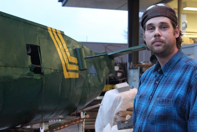 Ben Flaten is building a 19- by 20-foot replica B-25 model plane after a decade in recovery from a devastating accident in honor of his grandfather, William Olvitt of Portage, a World War II veteran who died in 2002. The Associated Press