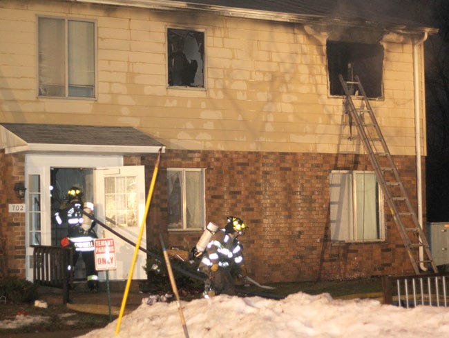Firefighters work to extinguish a blaze that claimed the life of an 11-month-old child early Sunday morning.
