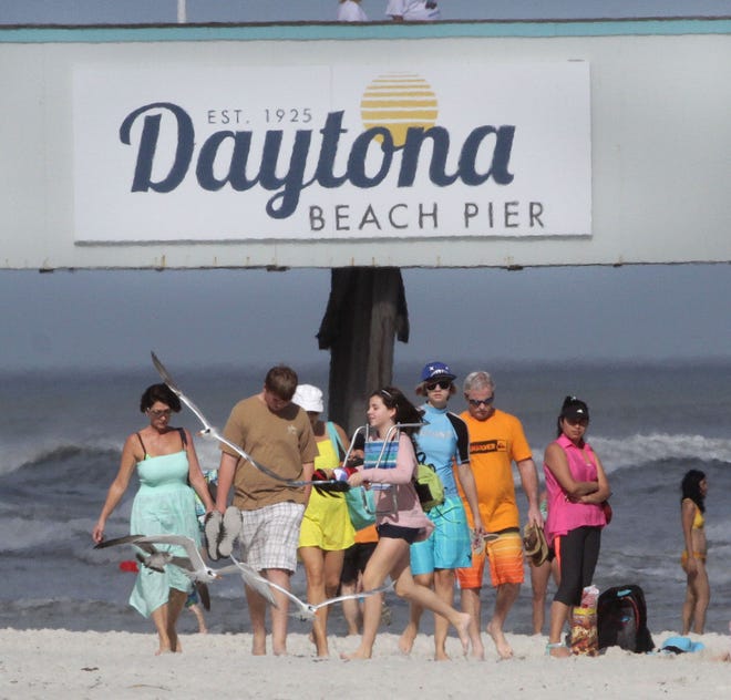 Beachgoers stay active along the beach as temperatures continue to break records for Daytona Beach.