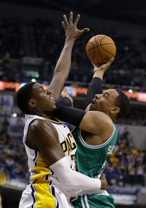 AP photo

Boston Celtics' Jared Sullinger, right, puts up a shot against Indiana Pacers' Ian Mahinmi during Sunday's game in Indianapolis.