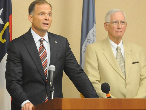 New Hanover County Commissioner Chairman Woody White (left) speaks at a news conference in September