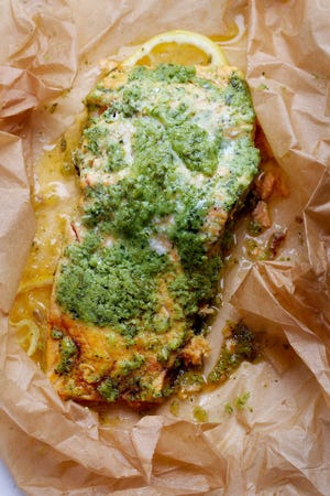 Salmon in packets with green herb marinade