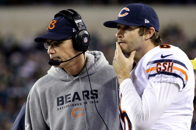 Chicago Bears' Jay Cutler, right, and head coach Marc Trestman walks on the sidelines during the second half of an NFL football game against the Philadelphia Eagles, Sunday, Dec. 22, 2013, in Philadelphia.
