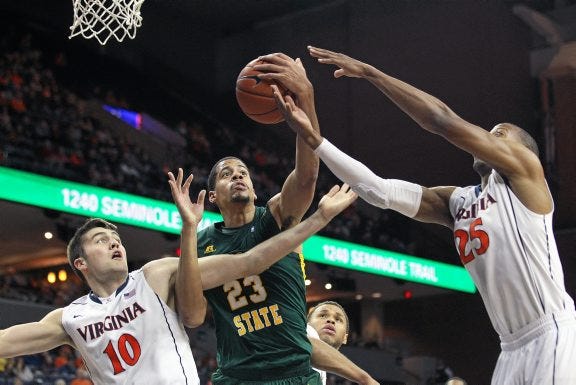 RYAN M. KELLY/THE DAILY PROGRESS VIA AP PHOTO
Norfolk State center Brandon Goode (23) fights for control of a rebound with Virginia forwards Mike Tobey (10) and Akil Mitchell (25) during the first half Monday night in Charlottesville.
