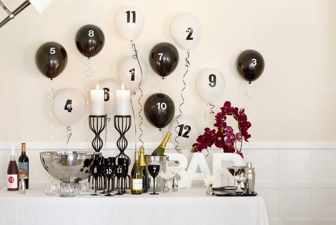 For a countdown-themed party, numbers and letters are the way to go. Stickers or decals are cheap and easy to find at craft stores.