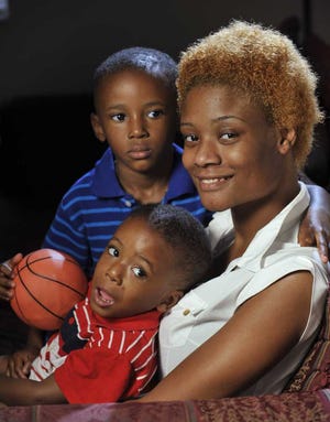 Janay Geddes, 24, with her sons Caleb Sam (top), 4, and Jordan Geddes, 3.  Will.Dickey@Jacksonville.com