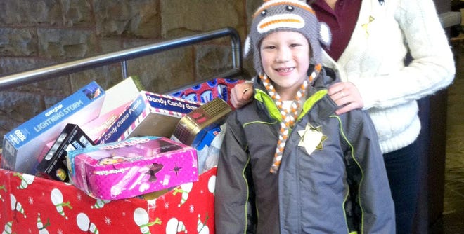"Awesome Joey The King" Fantozzi with his donation to the Monroe County Sheriff's Office's annual holiday toy drive.