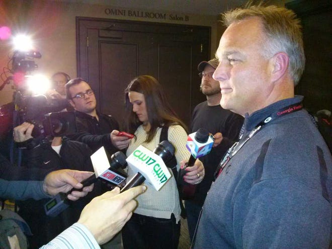 Garry Smits the Times-Union Georgia coach Mark Richt greets the media after his team arrived to prepare for the Gator Bowl.
