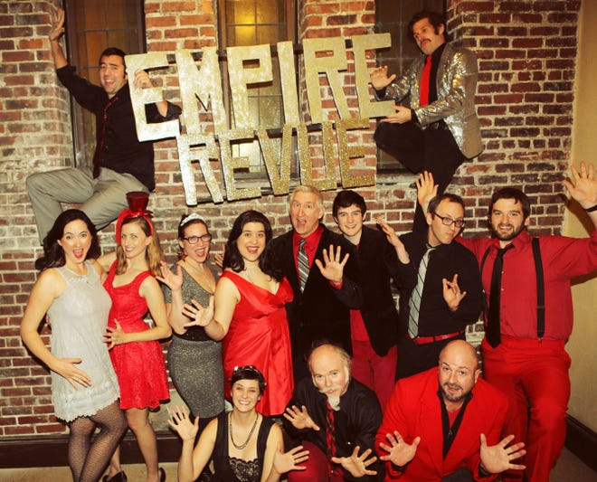 ? New Year's Eve Empire Revue at AS220, top row, holding the sign, from left to right: Alan Sousa and Stuart Wilson; middle row, left to right: Melissa Bowler, Casey Regan, Nicky Mariani, Kelly Seigh, Keith Munslow, Sam Bell, Tom Vale and Eric Fulford; bottom row, left to right: Kate Teichman, Richard Goulis and Steve Lynch.